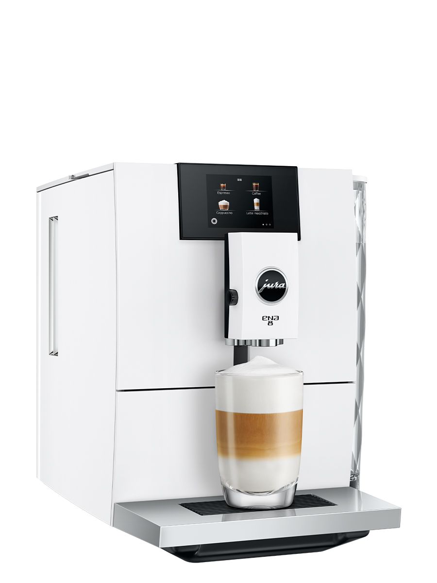 Angled view ENA 8 Full Nordic White showing touchscreen display panel, clear water tank and dispensing a Latte Macchiato into a clear glass