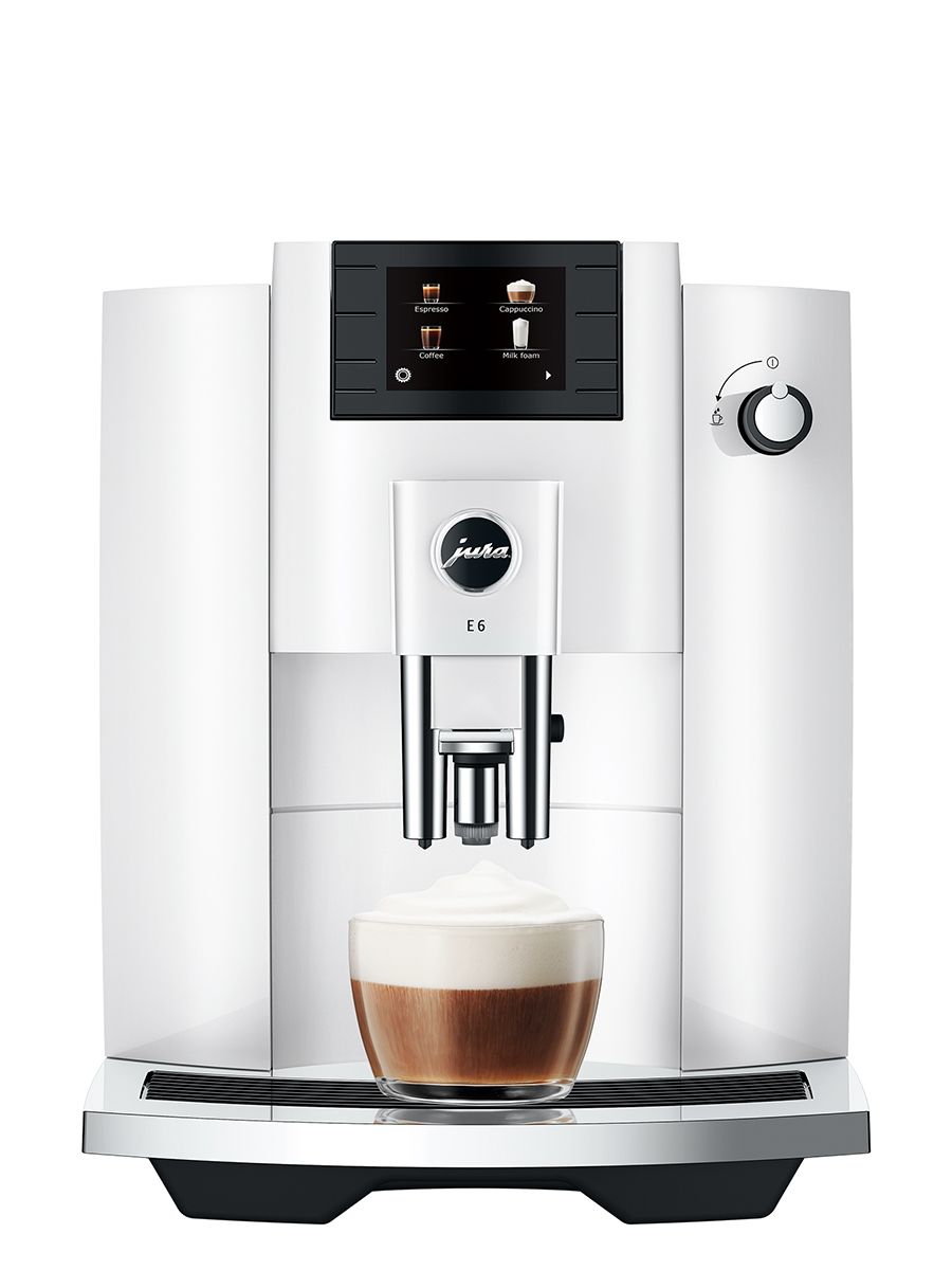 Jura E6 Piano White espresso machine, front view showing the drip tray and control panel, with a dispensed cappuccino