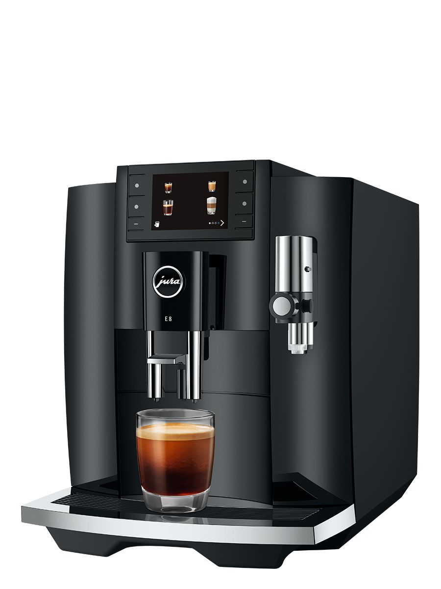 Side view of Jura E8 Piano Black NAC espresso machine with coffee dispensing spout and cup beneath, showcasing its sleek black exterior and espresso preparation capability.