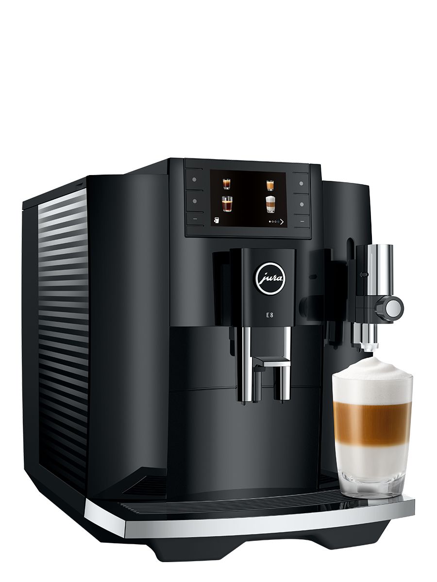 Side angle view of E8 piano Black showcasing the water tank, color display, and a Latte Macchiato in a glass cup