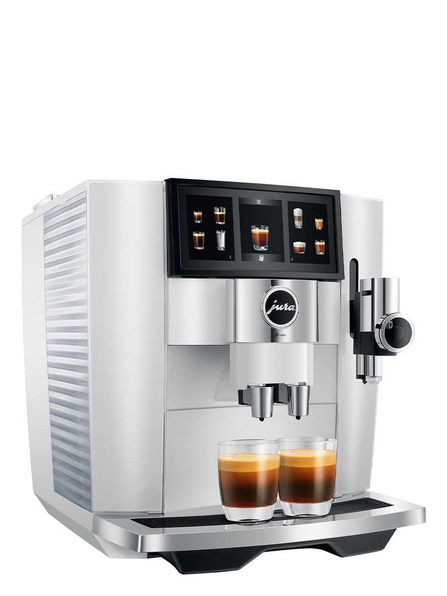 Left side view of the J8 twin Diamond White featuring water tank, touchscreen, coffee sports, with two espressos brewed at once in glass cups
