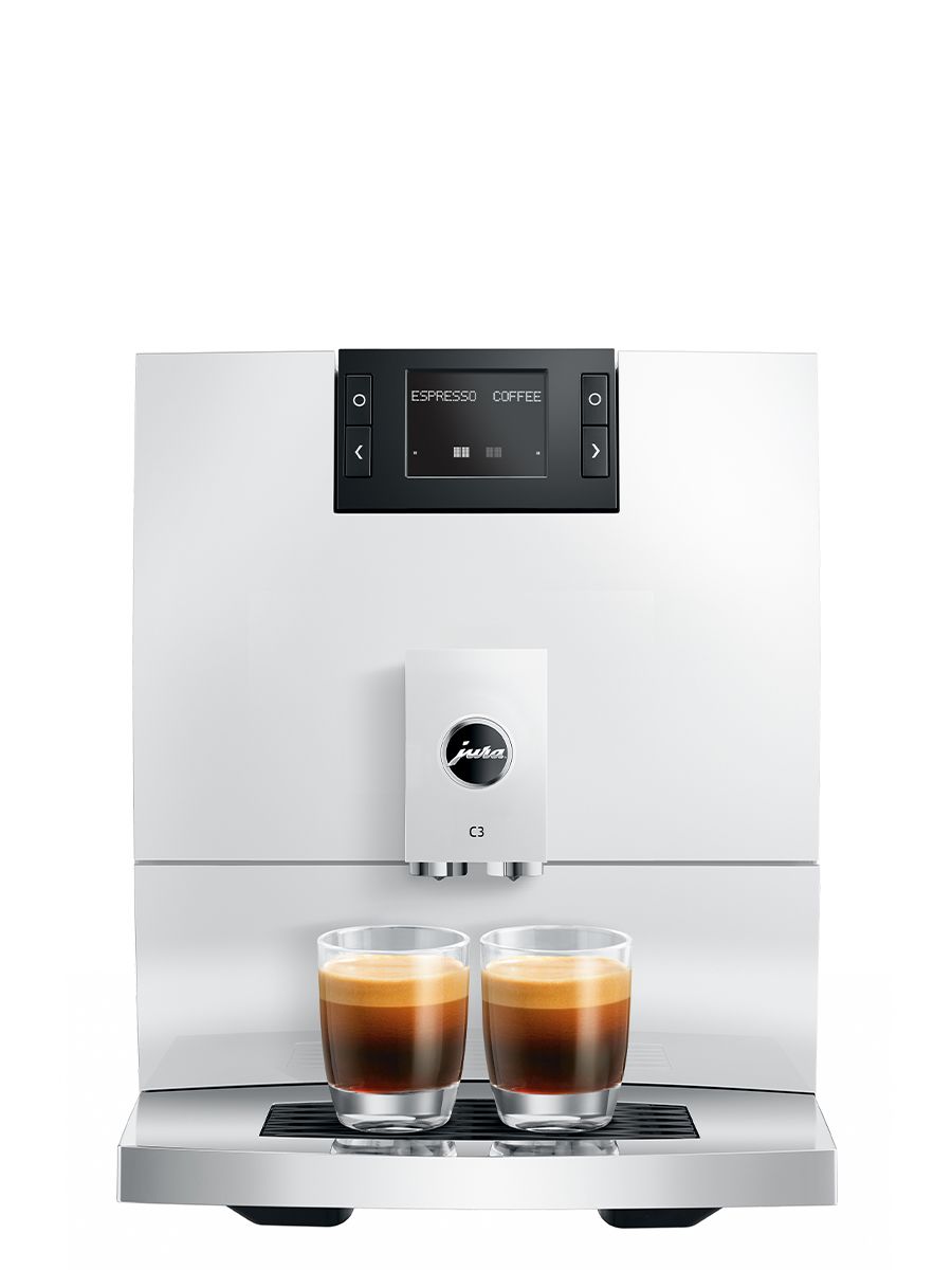 Front view of the JURA C3 Piano White automatic coffee machine dispensing two espresso drinks into glass cups on the drip tray.