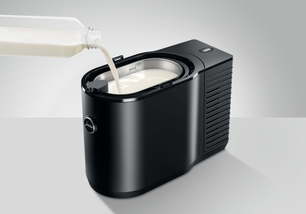 Right side view of milk being poured into Cool Control Black (2.5L)