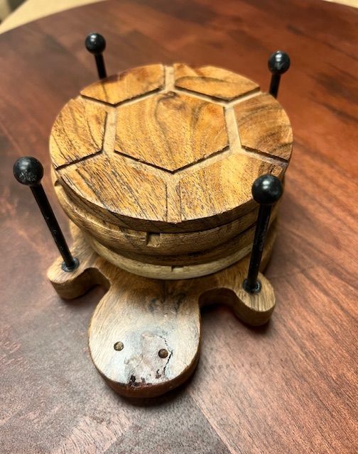 Set of Four Wooden Turtle Coasters and Iron Stand