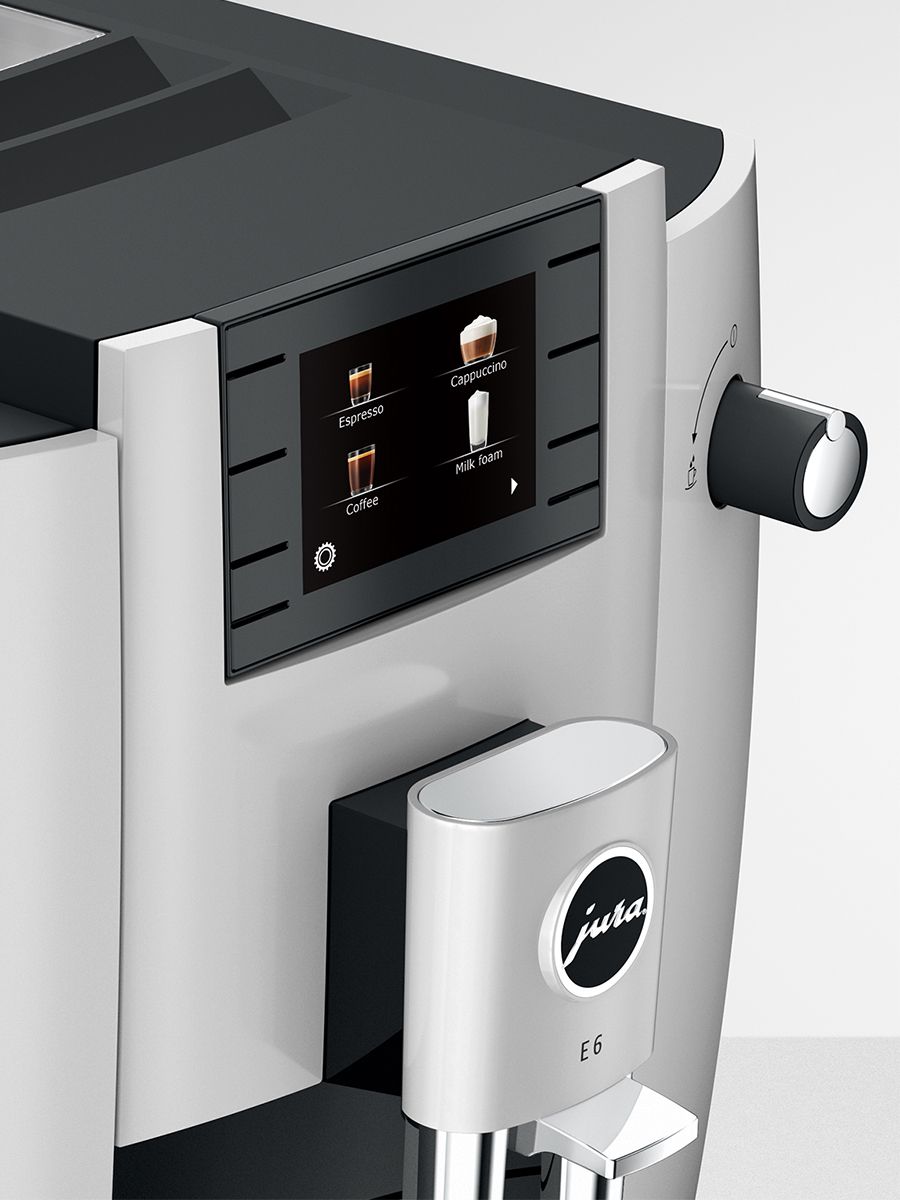 Side view close-up of Jura E6 Platinum NAC control panel featuring TFT color display and rotary switch.