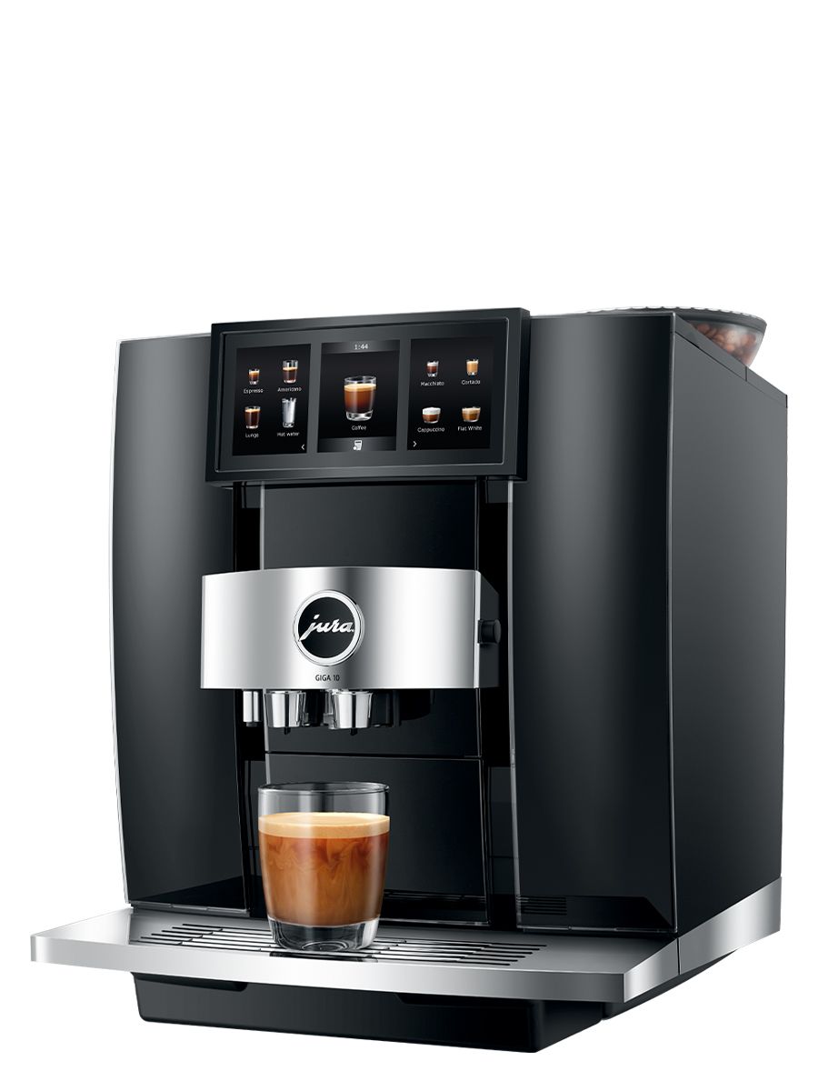 Left side view of GIGA 10 featuring touchscreen display, drip tray, coffee spouts, with cortado in a glass cup