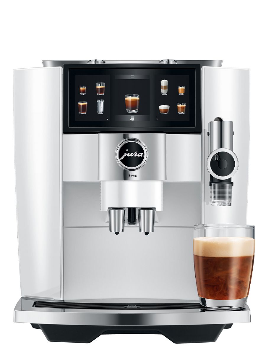 Front view of J8 twin Diamond White including touchscreen display, coffee spouts, drip tray, with a sweet latte in a glass cup