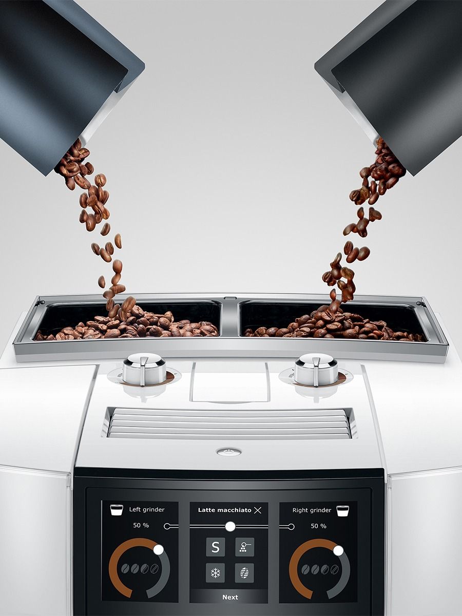 JURA J10 twin Diamond White coffee machine with dual bean containers being filled